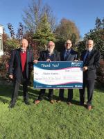 President Mike accompanied by fundraising chairs Chris 22/23 and Laurie 23/24 present a £2500 cheque to Pilgrim's Hospice Canterbury.